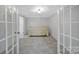 Bright bedroom features a tiled floor, decorative ceiling, and a cozy bed at 926 Meadow Lakes Rd, Rock Hill, SC 29732