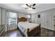Cozy bedroom featuring a wooden bed frame, ceiling fan, and ample natural light at 926 Meadow Lakes Rd, Rock Hill, SC 29732