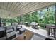 Expansive deck offering ample seating, multiple grills, and serene views of the surrounding greenery at 926 Meadow Lakes Rd, Rock Hill, SC 29732