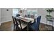 Elegant dining room featuring a dark wood table, plush chairs, and natural lighting at 926 Meadow Lakes Rd, Rock Hill, SC 29732