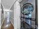 Hallway with stacked laundry machines and hardwood floors at 926 Meadow Lakes Rd, Rock Hill, SC 29732