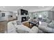 Cozy living room featuring a white brick fireplace, plush seating, and hardwood floors at 926 Meadow Lakes Rd, Rock Hill, SC 29732