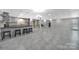 Large basement space with modern tile flooring and kitchen area at 926 Meadow Lakes Rd, Rock Hill, SC 29732