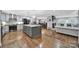 A bright living space showcases an island kitchen, dining area, fireplace and exposed hardwood floors at 926 Meadow Lakes Rd, Rock Hill, SC 29732