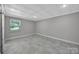 Bright room showcases neutral walls, tiled floor, and natural lighting through a window at 926 Meadow Lakes Rd, Rock Hill, SC 29732