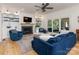 Stylish living room with a fireplace, built-in shelves, and comfortable seating at 9622 Penshurst Trce, Charlotte, NC 28210