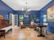 Well-lit office space featuring hardwood floors, stylish furniture, and a bright, airy atmosphere at 9622 Penshurst Trce, Charlotte, NC 28210