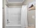 Clean bathroom featuring a shower-tub combo with white shower curtain and neutral wall color at 10637 Highway 52 Hwy, Rockwell, NC 28138