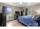 Comfortable bedroom with a study desk, hardwood floors, and windows offering a pleasant outdoor view at 10637 Highway 52 Hwy, Rockwell, NC 28138