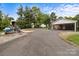 A long driveway leads to a house with a carport, with a boat trailer parked in the lot at 10637 Highway 52 Hwy, Rockwell, NC 28138