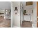 Welcoming hallway with elegant décor, hardwood floors, and a glimpse into the spacious living area at 10637 Highway 52 Hwy, Rockwell, NC 28138