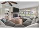 Comfortable living room featuring a stone fireplace and large windows at 10637 Highway 52 Hwy, Rockwell, NC 28138