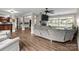 Spacious living room with hardwood floors, fireplace, and abundant natural light at 10637 Highway 52 Hwy, Rockwell, NC 28138