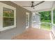Outdoor back porch featuring brick walls and tile flooring, perfect for entertaining at 1106 S South St, Gastonia, NC 28052