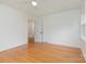 Bright bedroom with hardwood floors, ceiling fan, and neutral paint scheme at 1106 S South St, Gastonia, NC 28052