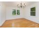 Charming dining room featuring hardwood floors, crown molding, and natural light at 1106 S South St, Gastonia, NC 28052