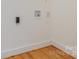 Laundry room hook ups with white walls and hardwood floors in a well-lit space at 1106 S South St, Gastonia, NC 28052