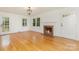 Spacious living room with fireplace, hardwood floors, and natural light at 1106 S South St, Gastonia, NC 28052