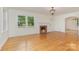 Bright living room with hardwood floors, fireplace, and white trim at 1106 S South St, Gastonia, NC 28052