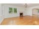 Bright living room with hardwood floors, fireplace, and white trim at 1106 S South St, Gastonia, NC 28052