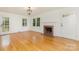 Spacious living room with fireplace, hardwood floors, and natural light at 1106 S South St, Gastonia, NC 28052
