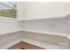 Walk-in pantry with built-in shelving for storage and organization with natural light from the window at 1106 S South St, Gastonia, NC 28052