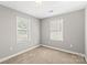 Bright bedroom features plush carpet and ample natural light at 113 W 5Th Ave, Gastonia, NC 28052