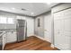The kitchen includes stainless appliances, granite countertops, and hardwood floors at 113 W 5Th Ave, Gastonia, NC 28052