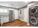 The kitchen includes stainless appliances, granite countertops, hardwood floors and washer/dryer at 113 W 5Th Ave, Gastonia, NC 28052