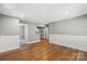 Open-concept space with hardwood floors and light paint at 113 W 5Th Ave, Gastonia, NC 28052