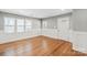 Inviting living room with hardwood floors, neutral paint, and bright windows at 113 W 5Th Ave, Gastonia, NC 28052