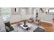 Bright living room with hardwood floors, large windows, and stylish decor at 113 W 5Th Ave, Gastonia, NC 28052