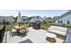 Relaxing back patio with comfortable seating, dining area and grill, perfect for outdoor entertaining at 12001 Sam Snead Ct, Lancaster, SC 29720