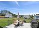 Spacious patio with an umbrella-shaded dining set, grill, and views of the backyard and neighborhood at 12001 Sam Snead Ct, Lancaster, SC 29720