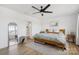 Cozy bedroom featuring hardwood floors, ceiling fan, and ensuite bathroom at 12001 Sam Snead Ct, Lancaster, SC 29720
