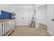 Cozy Bedroom with a crib, plush carpet, and natural light at 12001 Sam Snead Ct, Lancaster, SC 29720