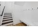 Entry way with stairs, coat hooks and built in bench at 12001 Sam Snead Ct, Lancaster, SC 29720
