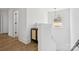 Bright hallway with wood floors and natural light from the window at 12001 Sam Snead Ct, Lancaster, SC 29720