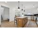 Bright kitchen features a large island, stainless steel appliances, and modern pendant lighting at 12001 Sam Snead Ct, Lancaster, SC 29720