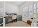 Bright home office featuring a built-in desk, ample natural light, and stylish decor at 12001 Sam Snead Ct, Lancaster, SC 29720