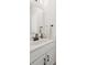 Stylish powder room with a white vanity, modern faucet, and elegant mirror at 12001 Sam Snead Ct, Lancaster, SC 29720