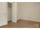 Cozy bedroom with modern flooring and a closet for storage at 1218 Milan Rd, Charlotte, NC 28216