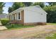 Charming single-story home featuring a combination of white siding and brick accents at 1218 Milan Rd, Charlotte, NC 28216