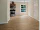 Bright eat-in kitchen with wood floors, plenty of natural light, and stainless appliances at 1218 Milan Rd, Charlotte, NC 28216