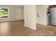 Open living area with modern flooring and natural light from a large window at 1218 Milan Rd, Charlotte, NC 28216