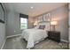 Cozy bedroom featuring carpeted floors, natural light from the window, and neutral wall color at 124 Kristin View Ln # Townhome A, Troutman, NC 28166