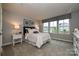 Bright bedroom with large windows, neutral walls, and plush carpeting, creating a comfortable and inviting space at 124 Kristin View Ln # Townhome A, Troutman, NC 28166