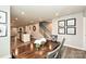 Open dining room and living space with hardwood floors and a staircase with a white railing at 124 Kristin View Ln # Townhome A, Troutman, NC 28166