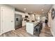 Bright kitchen with an expansive island, stainless steel appliances, and bar stool seating at 124 Kristin View Ln # Townhome A, Troutman, NC 28166
