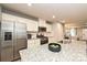 Modern kitchen with stainless steel appliances, white cabinets, and an island with a granite countertop at 124 Kristin View Ln # Townhome A, Troutman, NC 28166